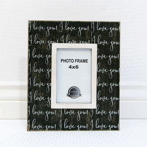 Black, wooden picture frame with the words "I Love You" in white lettering.