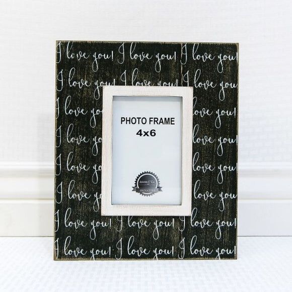 Black, wooden picture frame with the words 