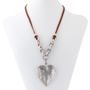 Large hand made hammered silver heart pendant with a leather and silver chain necklace.   Necklace measures 23" with a 3" extender.  Heart pendant is 4"long and 2.25" wide.