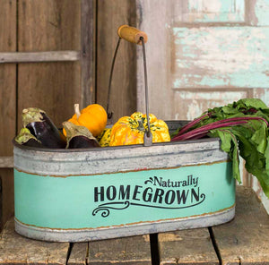 Galvanized Two Tone Oval Metal Bucket with the Words " Naturally Home Grown" Painted On.
