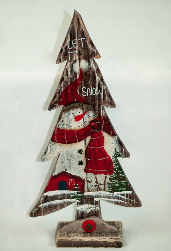 Wooden Christmas tree featuring a friendly snowman behind a wintery, glittery scene. Sets on a wood base with a snow drift. 