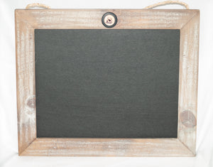 Chalkboard framed in white washed gray barn wood.  