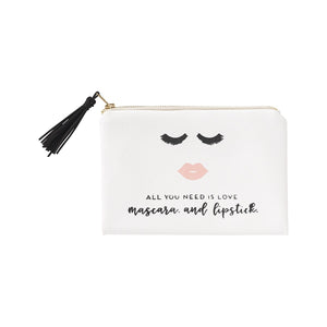 Adorable white cosmetic bag with black tassel zipper pull. Imprinted on the front are lashes + lips with the words "All You Need Is Love, Mascara and Lipstick"  