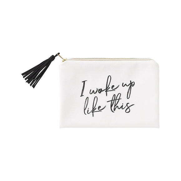 White cosmetic bag with a black tassel zipper pull and the words 